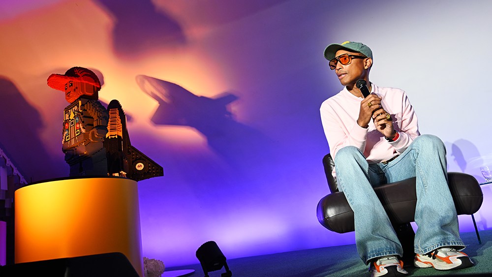 The LEGO Group and Pharrell Williams celebrate the launch of their collaboration 4 via Getty Images