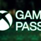 white glowing xbox game pass logo over blurred inscryption promo screenshot